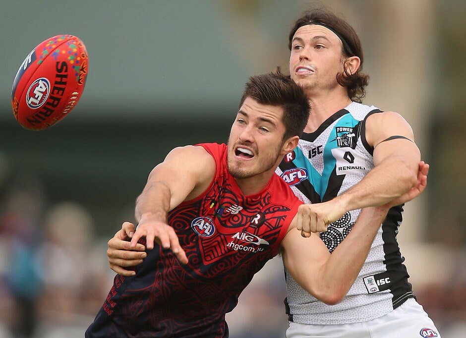 AFL 2016 Rd 10 - Melbourne v Port Adelaide ALICE SPRINGS, AUSTRALIA - MAY 28: Alex Neal-Bullen of the Demons competes with Jasper Pittard of the Power during the 2016 AFL Round 10 match between the Melbourne Demons and Port Adelaide Power at TIO Traeger Park on May 28, 2016 in Alice Springs, Australia. (Photo by Sean Garnsworthy/AFL Media)